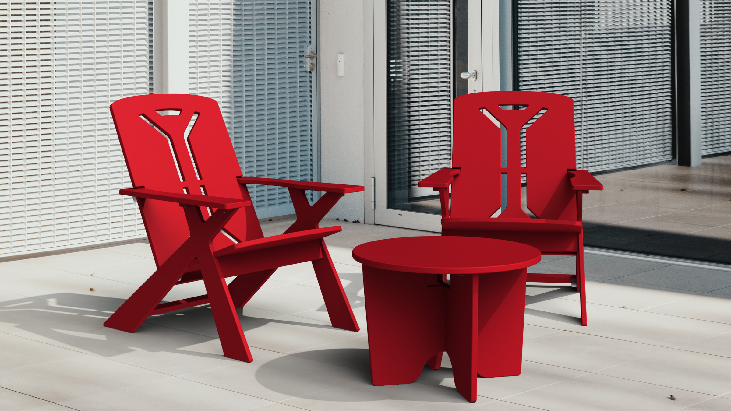 Sustainably made, red outdoor lounge chairs and red outdoor table.