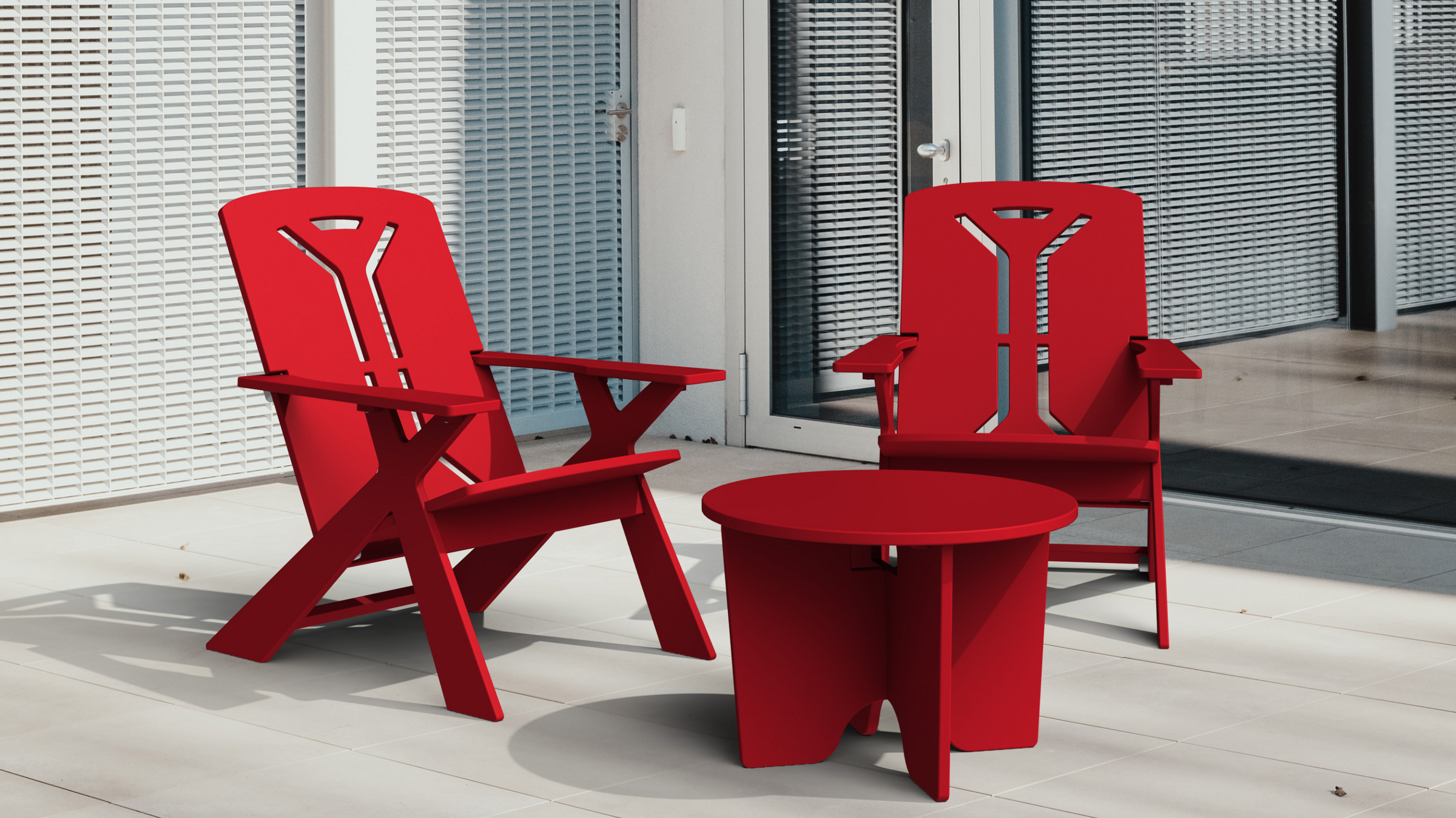 Sustainably made, red outdoor lounge chairs and red outdoor table. 